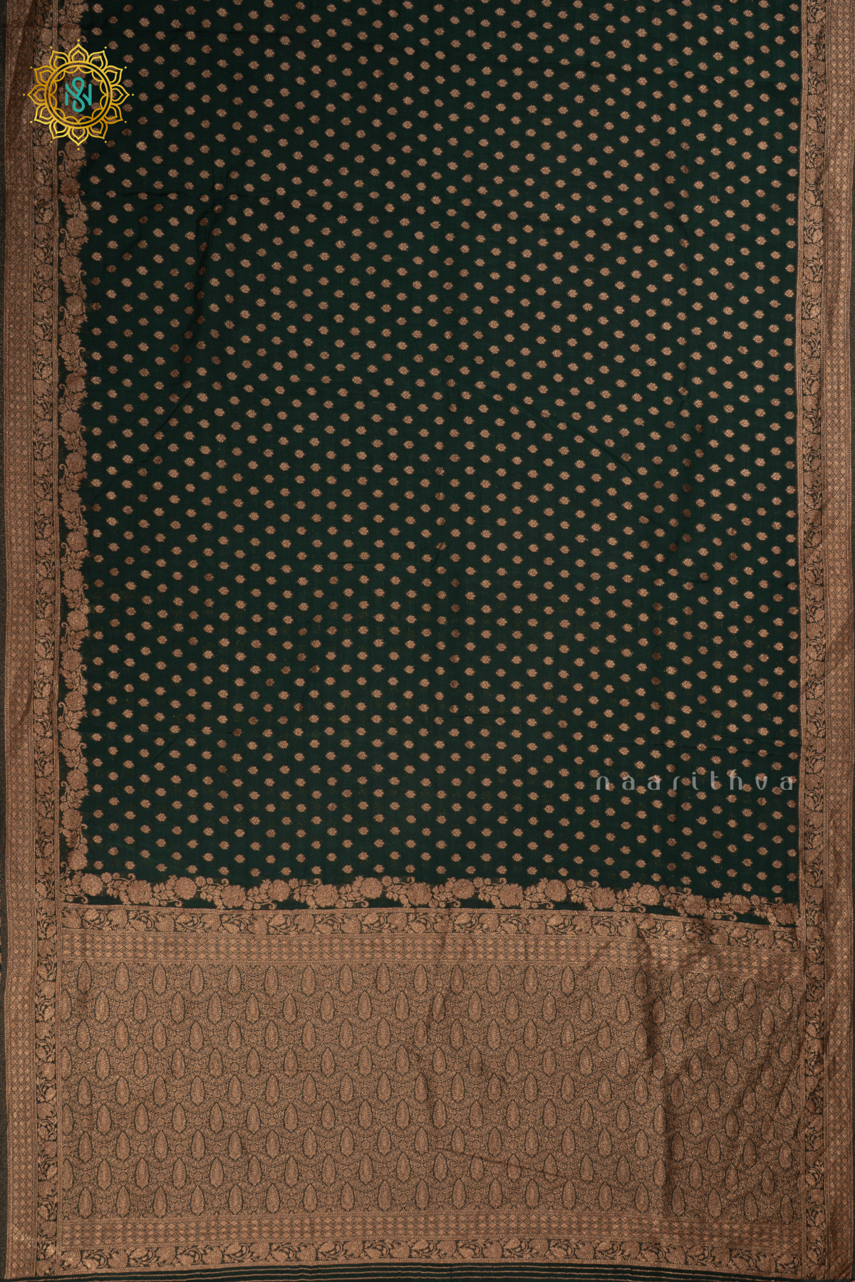 Bottle green - Semi georgette saree with allover zari buttas and zari border