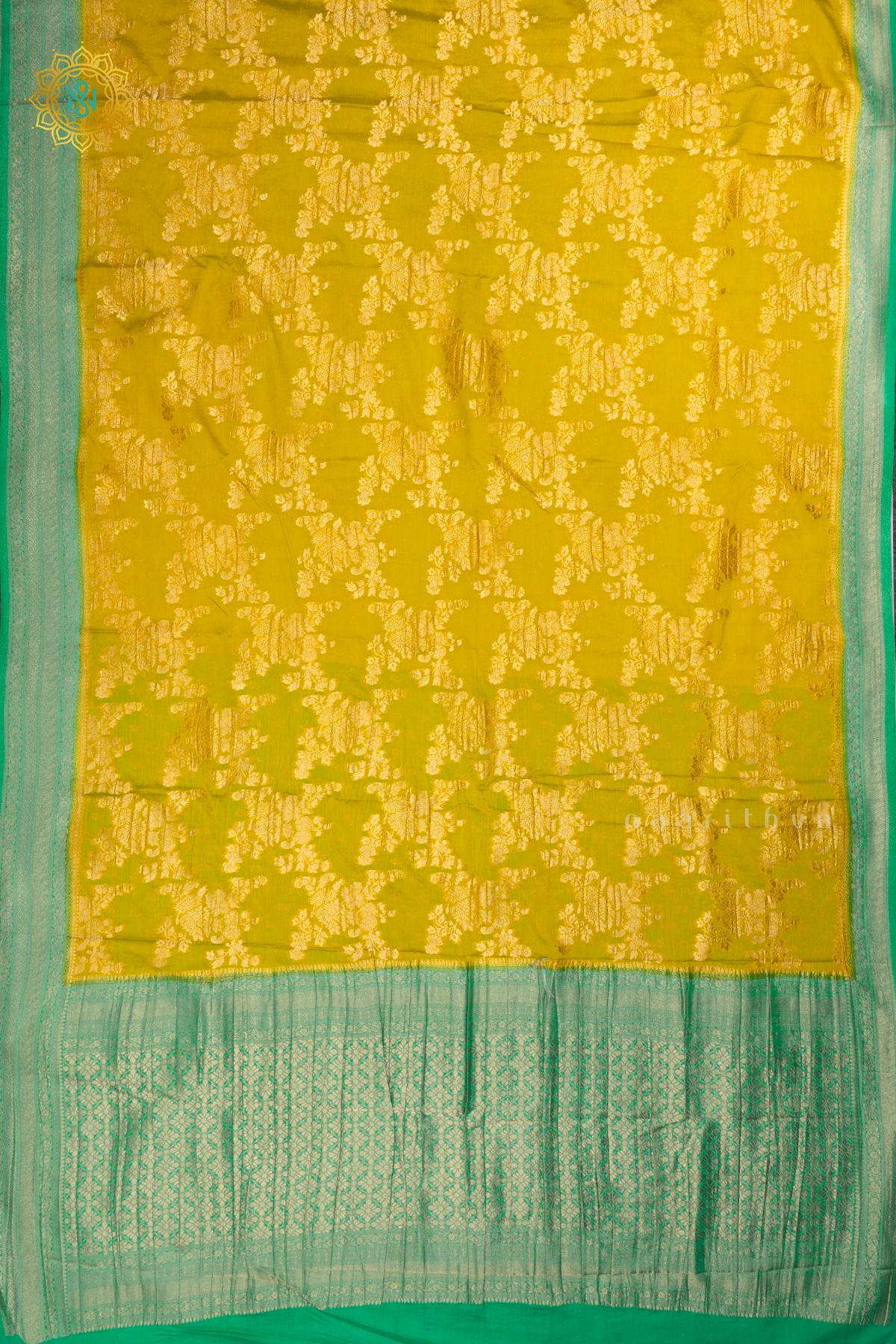 Yellow With Aqua Green Semi Crepe Georgette With Zari Woven Floral Brocade Weaves And Zari Woven Contrast Border