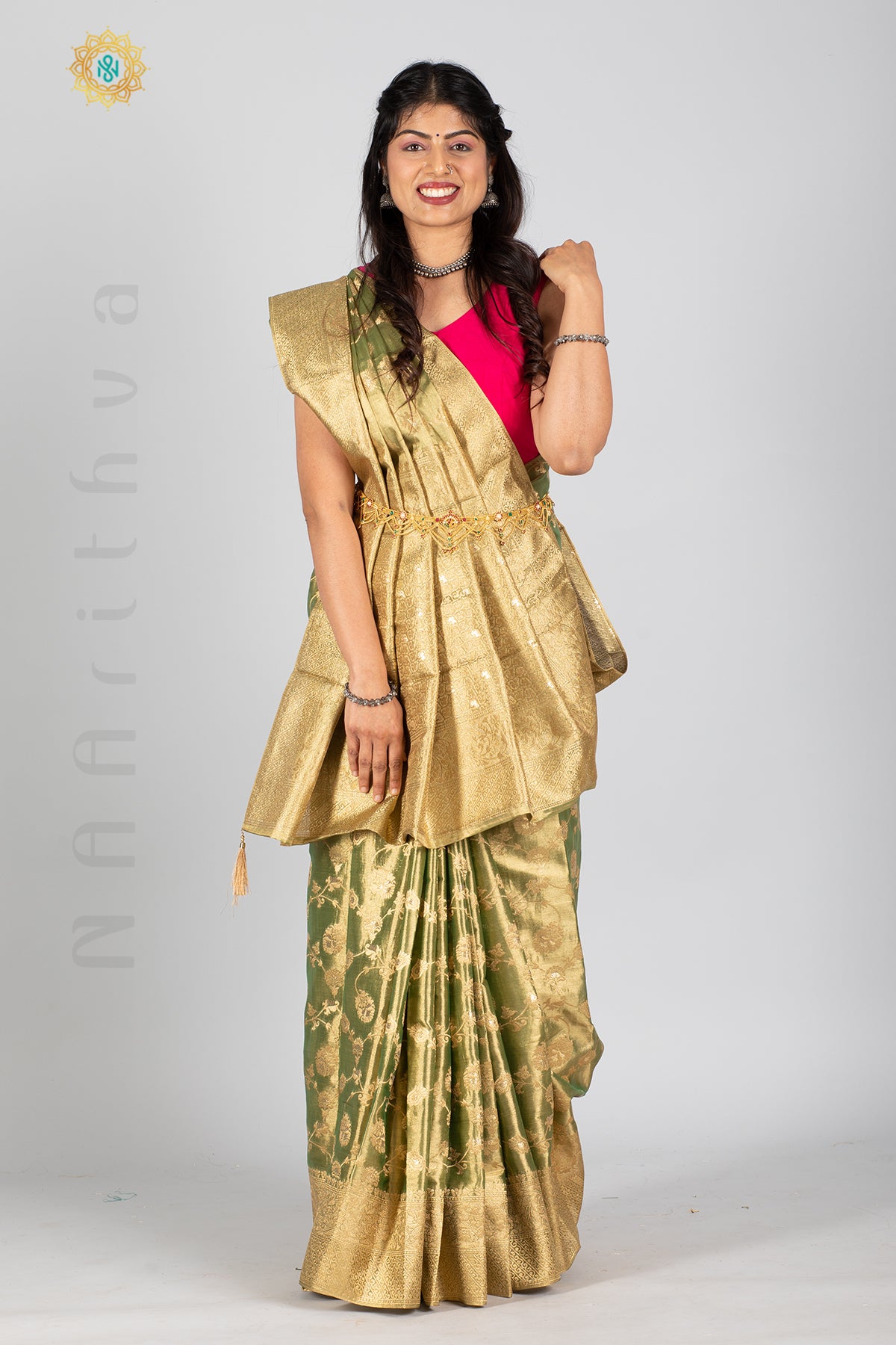 GREEN TISSUE SILK IN BROCADE WEAVES ALLOVER THE BODY WITH ZARI WOVEN PALLU & TISSUE BLOUSE