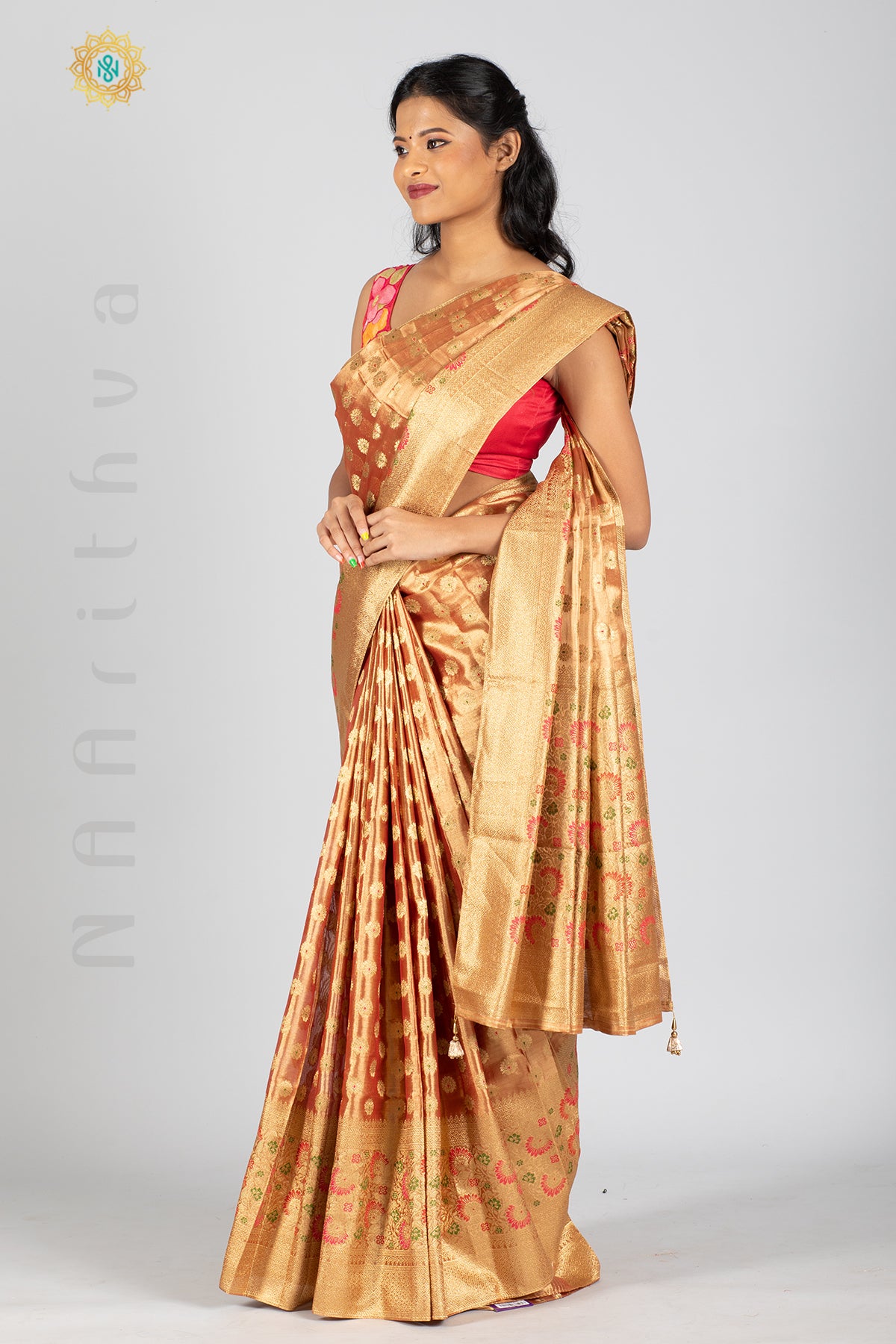 ROSE GOLD TISSUE SILK IN MEENA BUTTAS ALLOVER THE BODY WITH ZARI WOVEN PALLU & TISSUE BLOUSE
