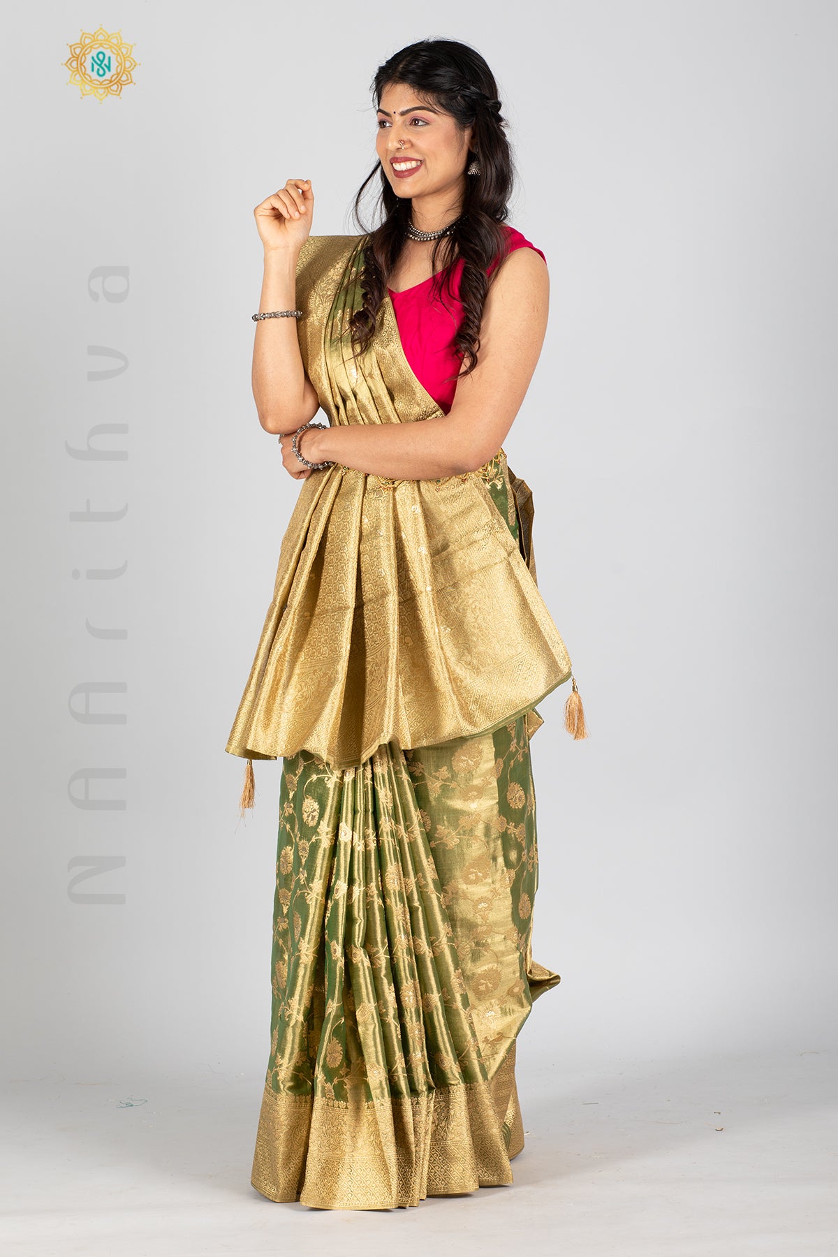 GREEN TISSUE SILK IN BROCADE WEAVES ALLOVER THE BODY WITH ZARI WOVEN PALLU & TISSUE BLOUSE