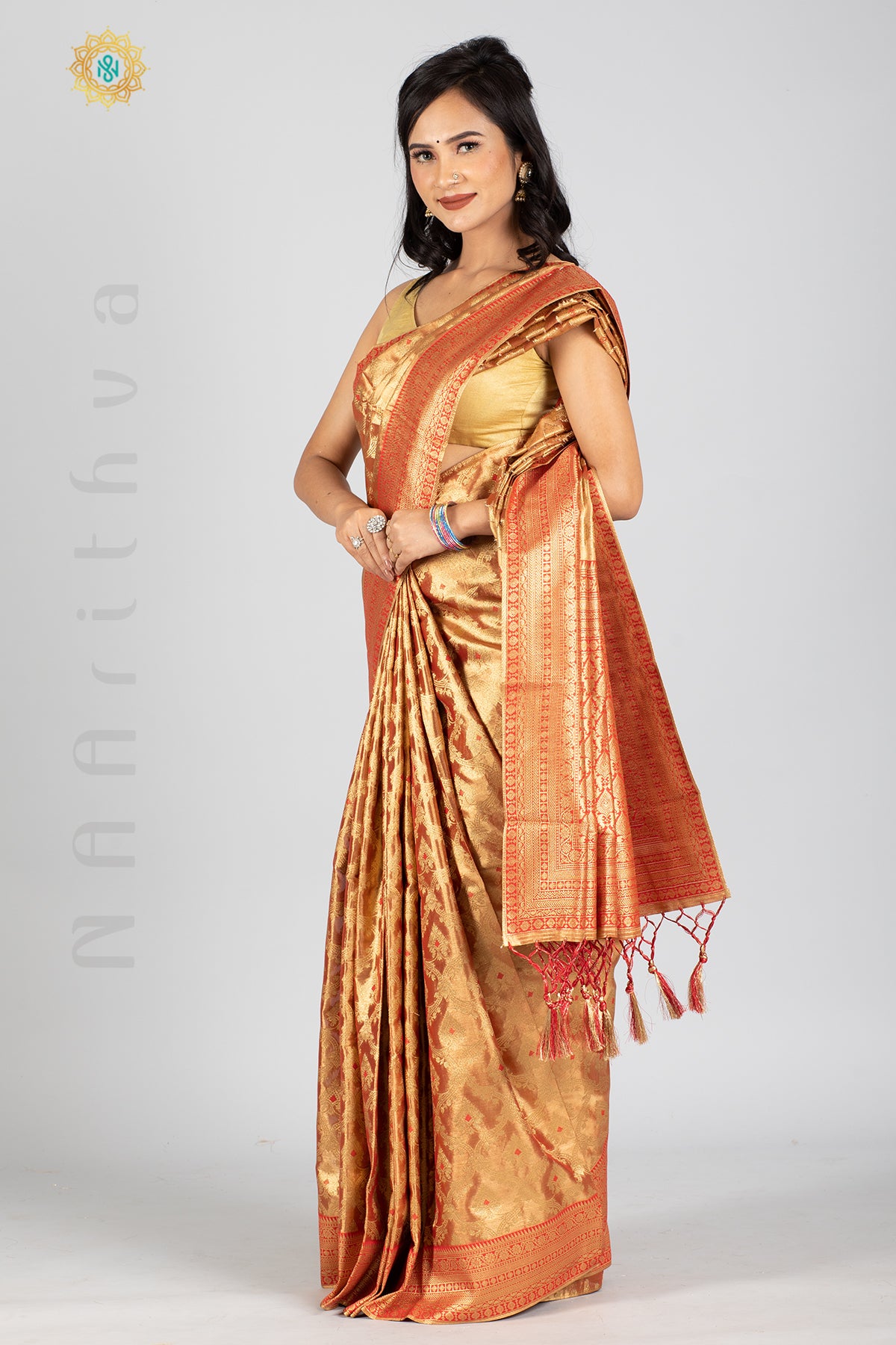 ROSE GOLD TISSUE SILK IN MEENA BUTTAS ALLOVER THE BODY WITH ZARI WOVEN PALLU & TISSUE BLOUSE