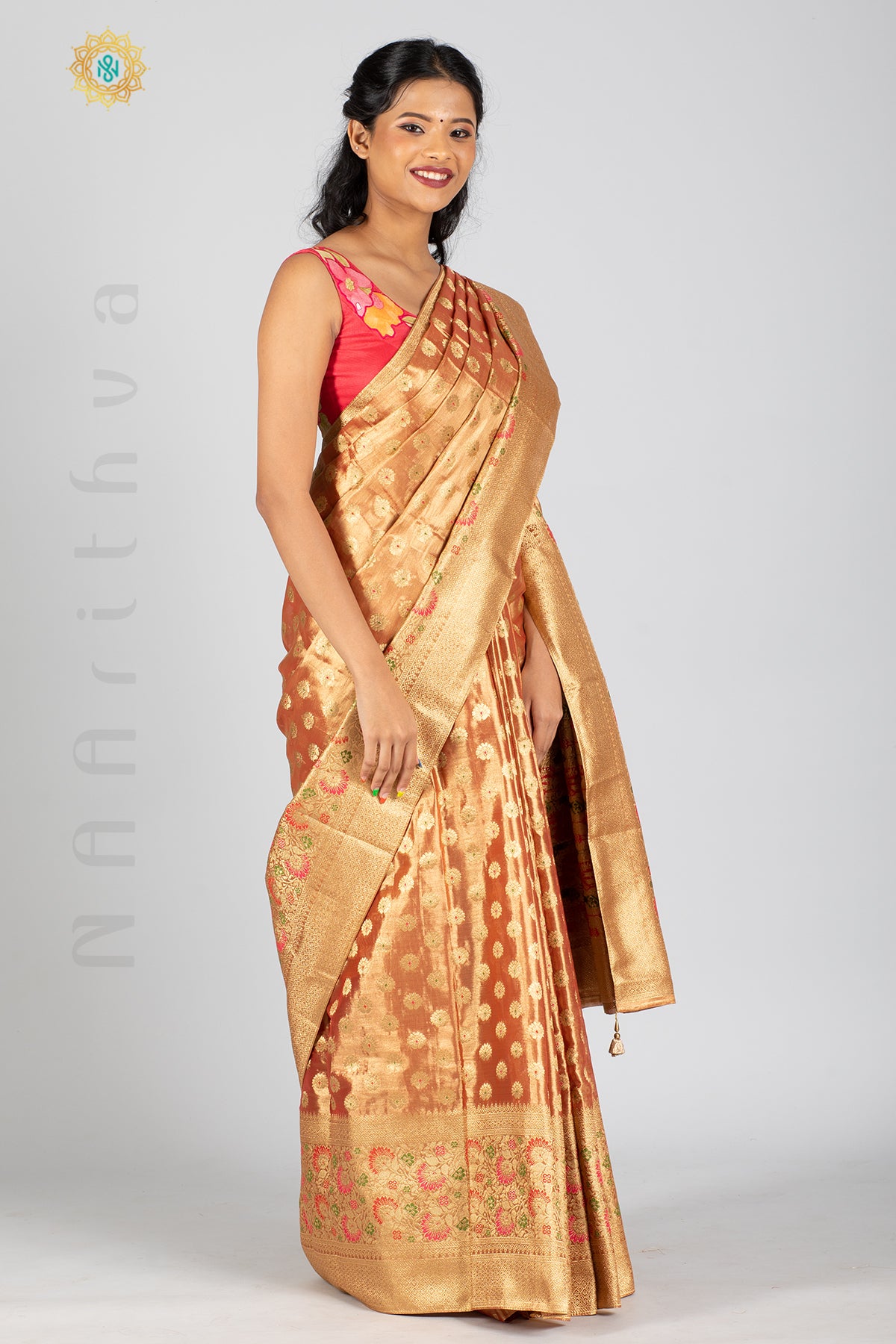 ROSE GOLD TISSUE SILK IN MEENA BUTTAS ALLOVER THE BODY WITH ZARI WOVEN PALLU & TISSUE BLOUSE