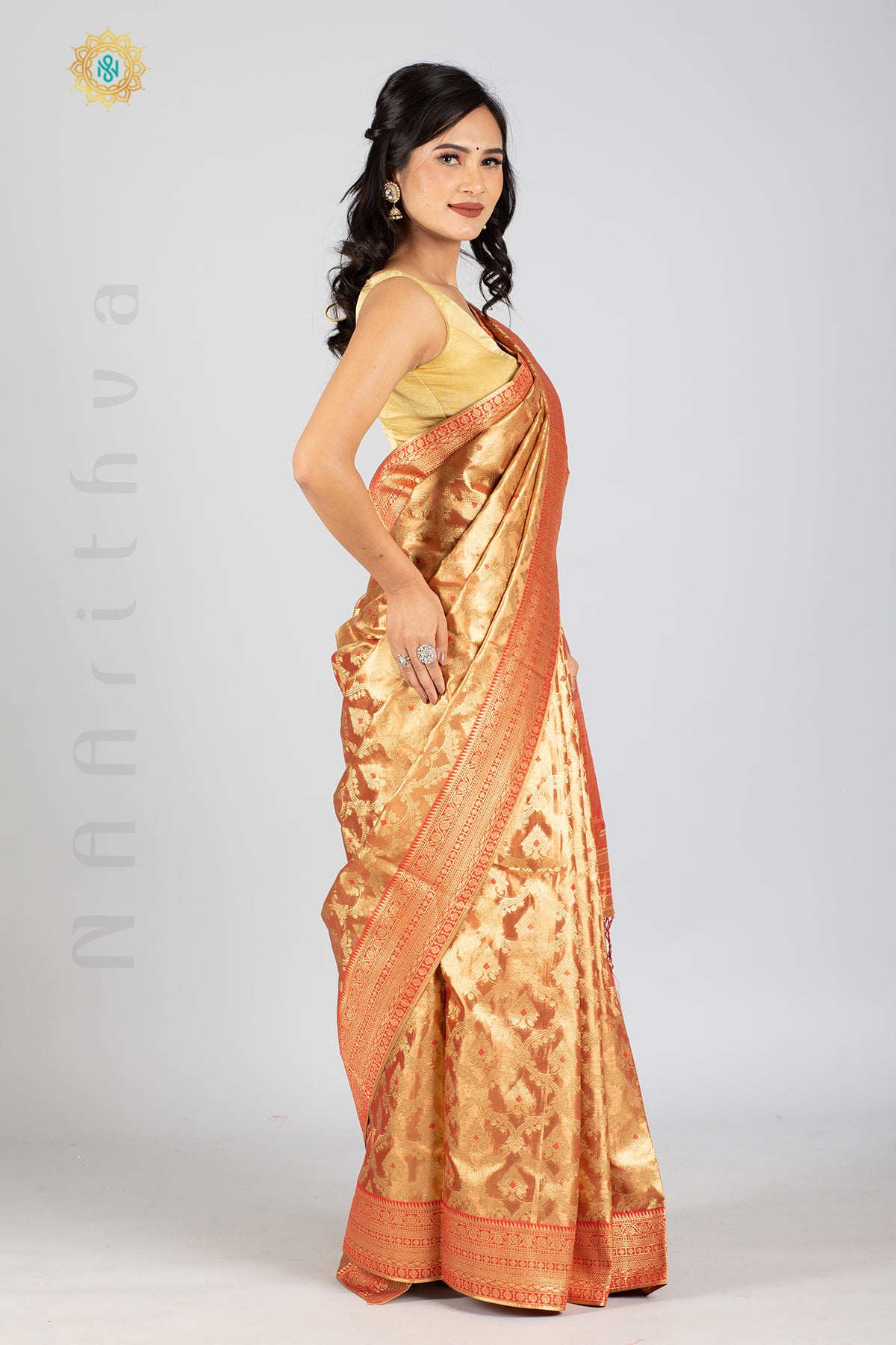 ROSE GOLD TISSUE SILK IN MEENA BUTTAS ALLOVER THE BODY WITH ZARI WOVEN PALLU & TISSUE BLOUSE