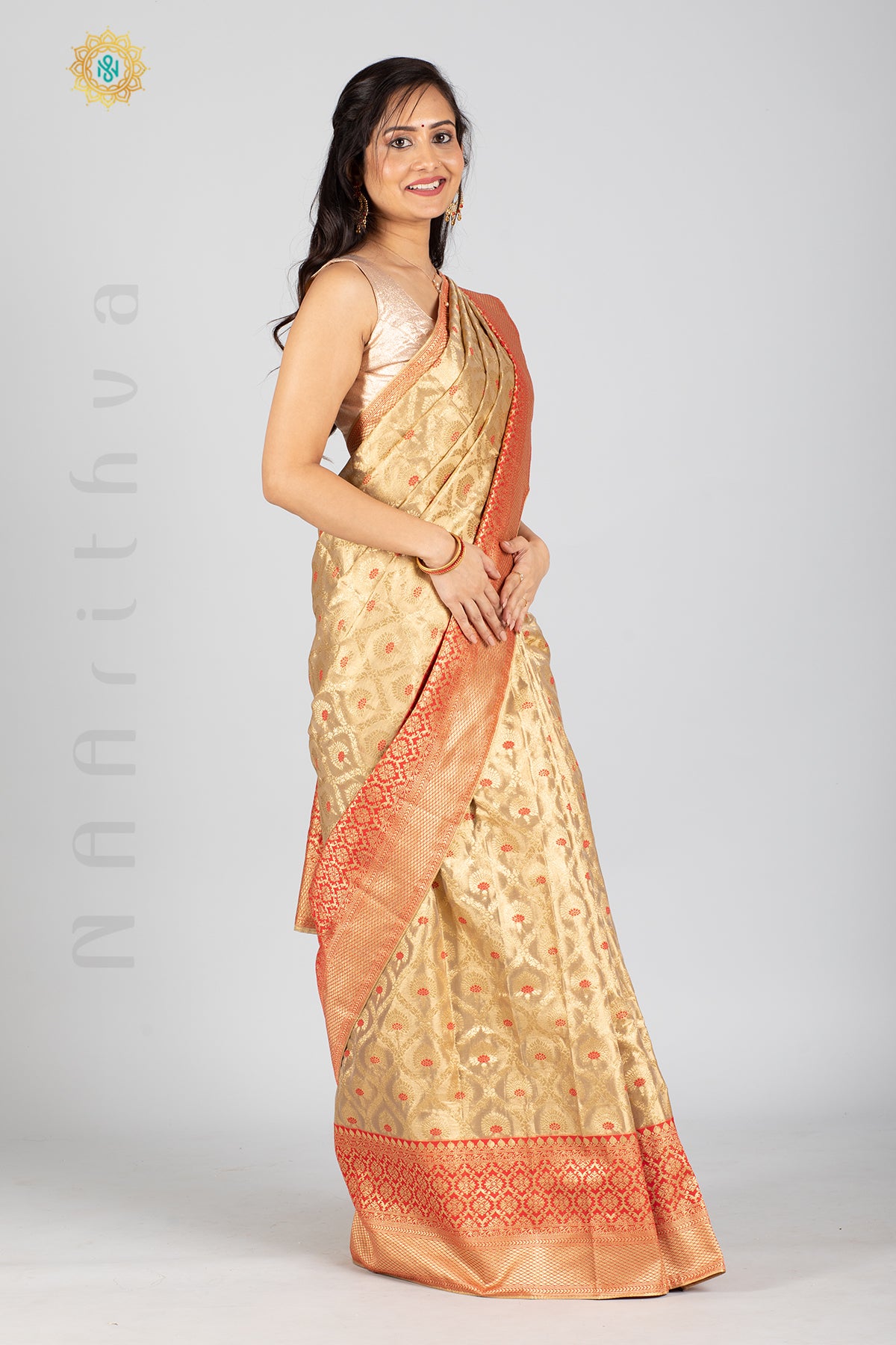 GOLD TISSUE SILK IN MEENA BUTTAS ALLOVER THE BODY WITH ZARI WOVEN PALLU & TISSUE BLOUSE