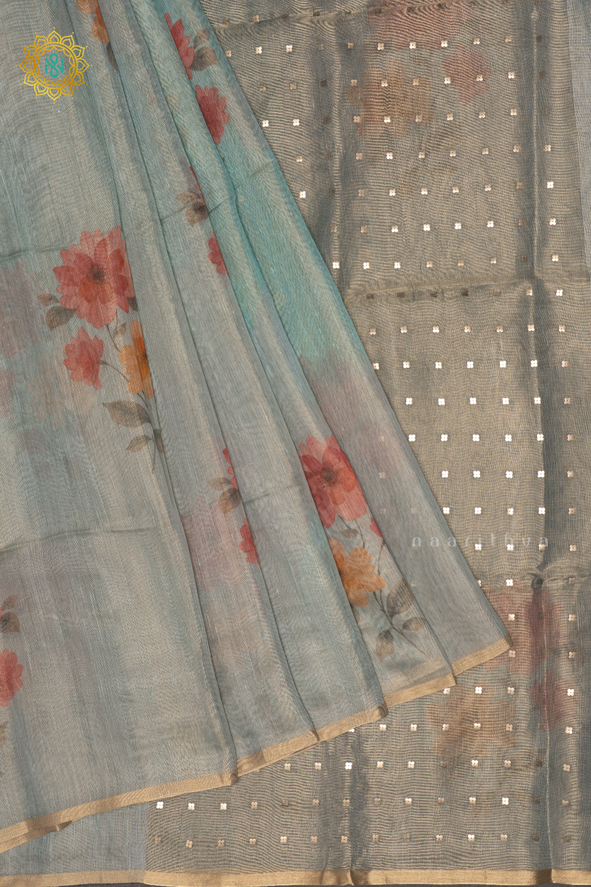 Aqua Blue Linen Tissue Saree With Floral Prints On The Body And Tissue Border
