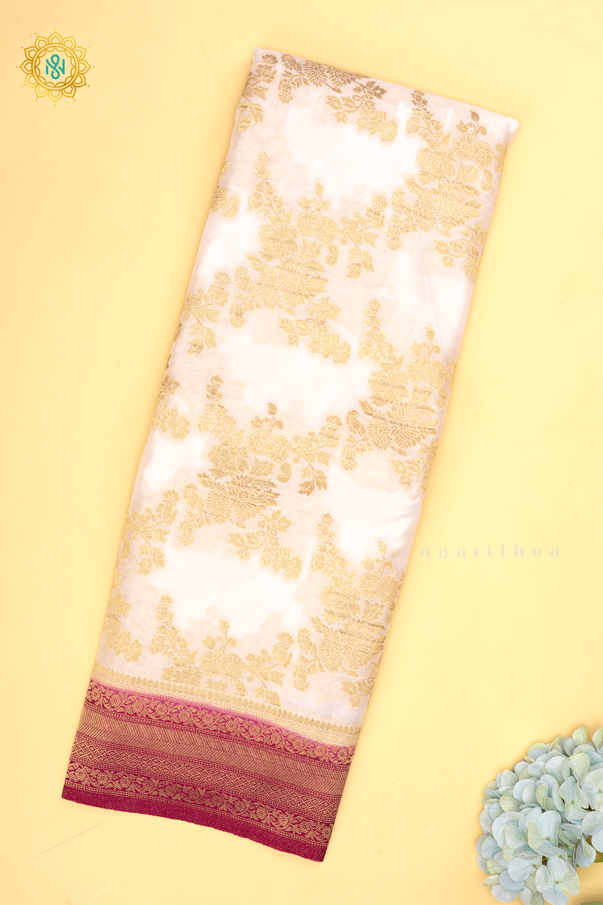 White With Pink Semi Crepe Georgette With Zari Woven Floral Brocade Weaves And Zari Woven Contrast Border