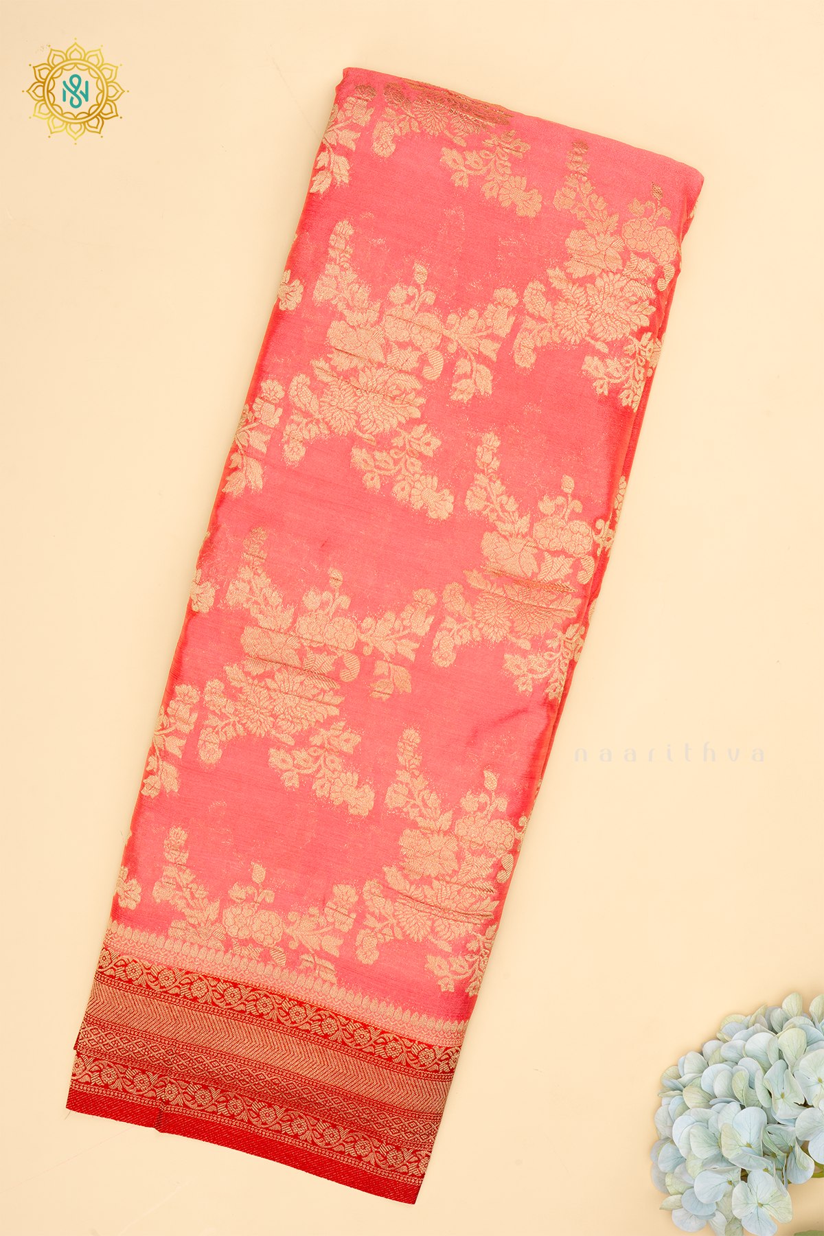 Light Pink With Red Semi Crepe Georgette With Zari Woven Floral Brocade Weaves And Zari Woven Contrast Border
