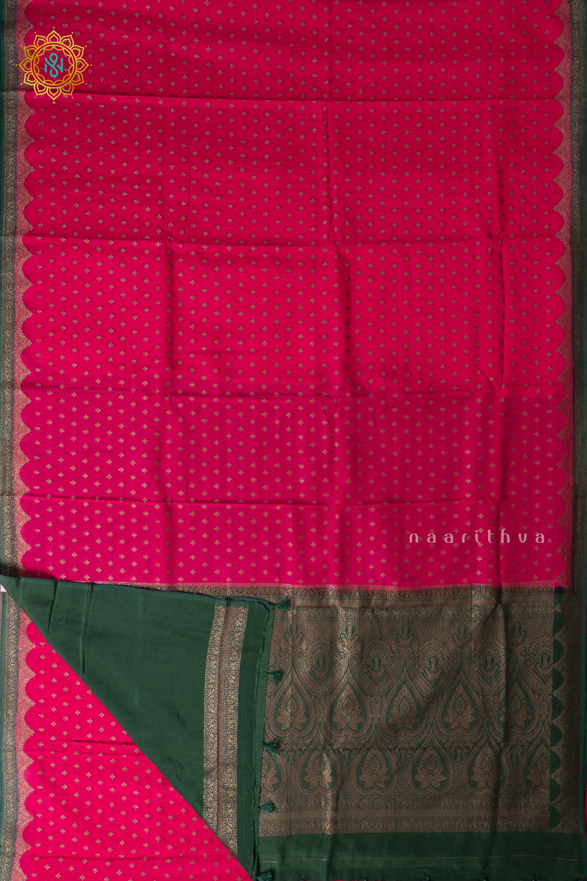 Rani Pink with Bottle Green Semi Crepe Silk with Allover Woven Buttas and Contrast Scallop Zari Border,Pallu and Blouse