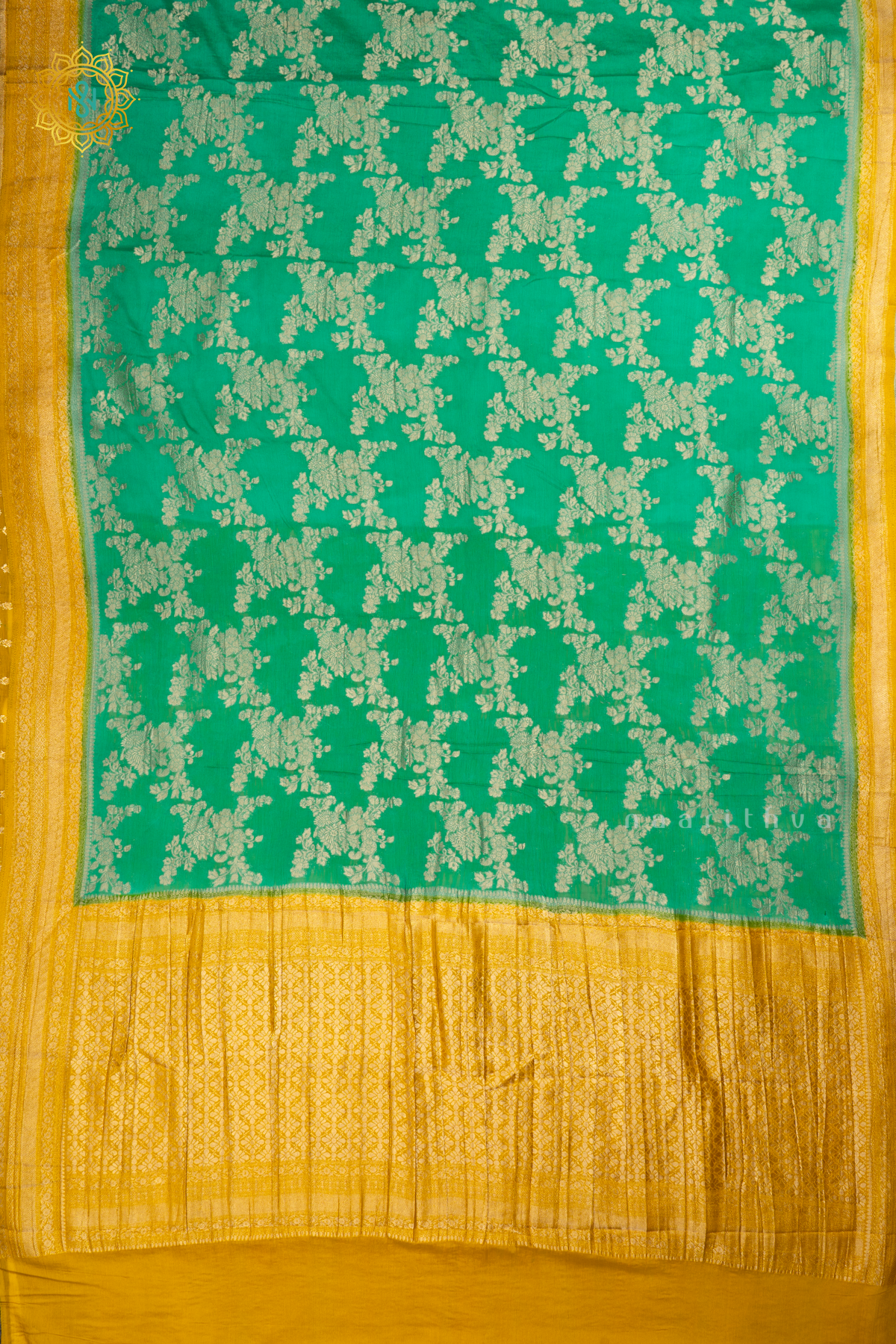 Aqua Green With Yellow Semi Crepe Georgette With Zari Woven Floral Brocade Weaves And Zari Woven Contrast Border