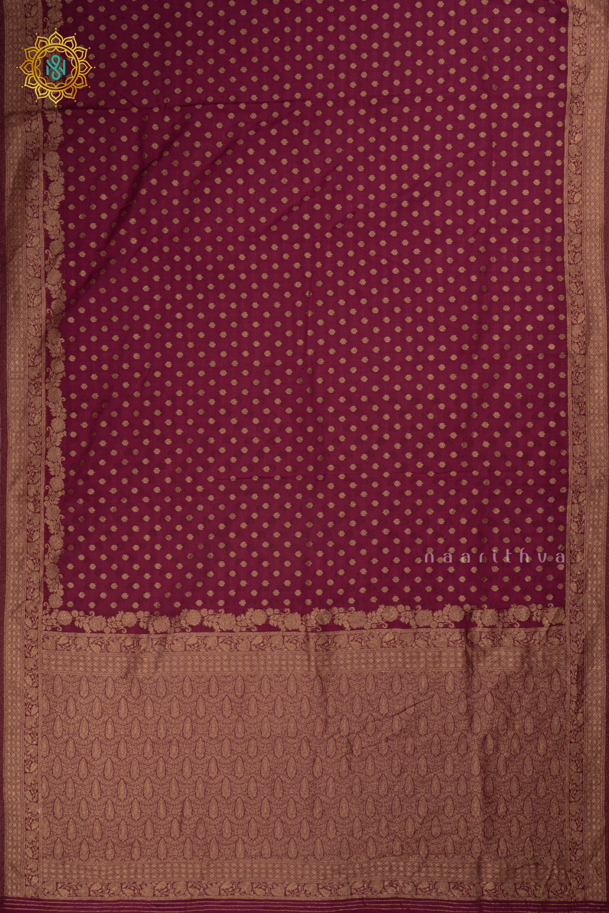 Maroon - Semi georgette saree with allover zari buttas and zari border