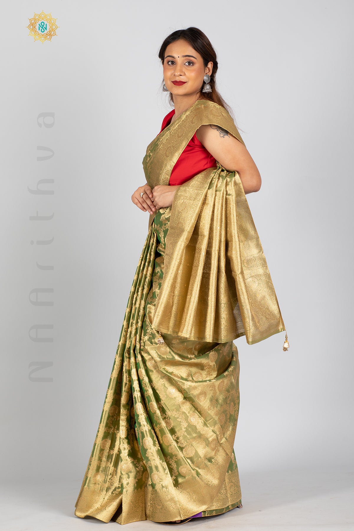 GREEN TISSUE SILK IN BROCADE WEAVES ALLOVER THE BODY WITH ZARI WOVEN PALLU & TISSUE BLOUSE