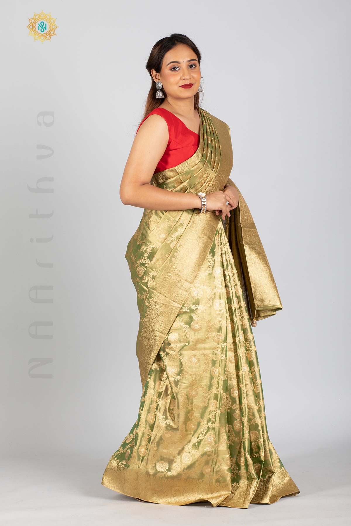 GREEN TISSUE SILK IN BROCADE WEAVES ALLOVER THE BODY WITH ZARI WOVEN PALLU & TISSUE BLOUSE