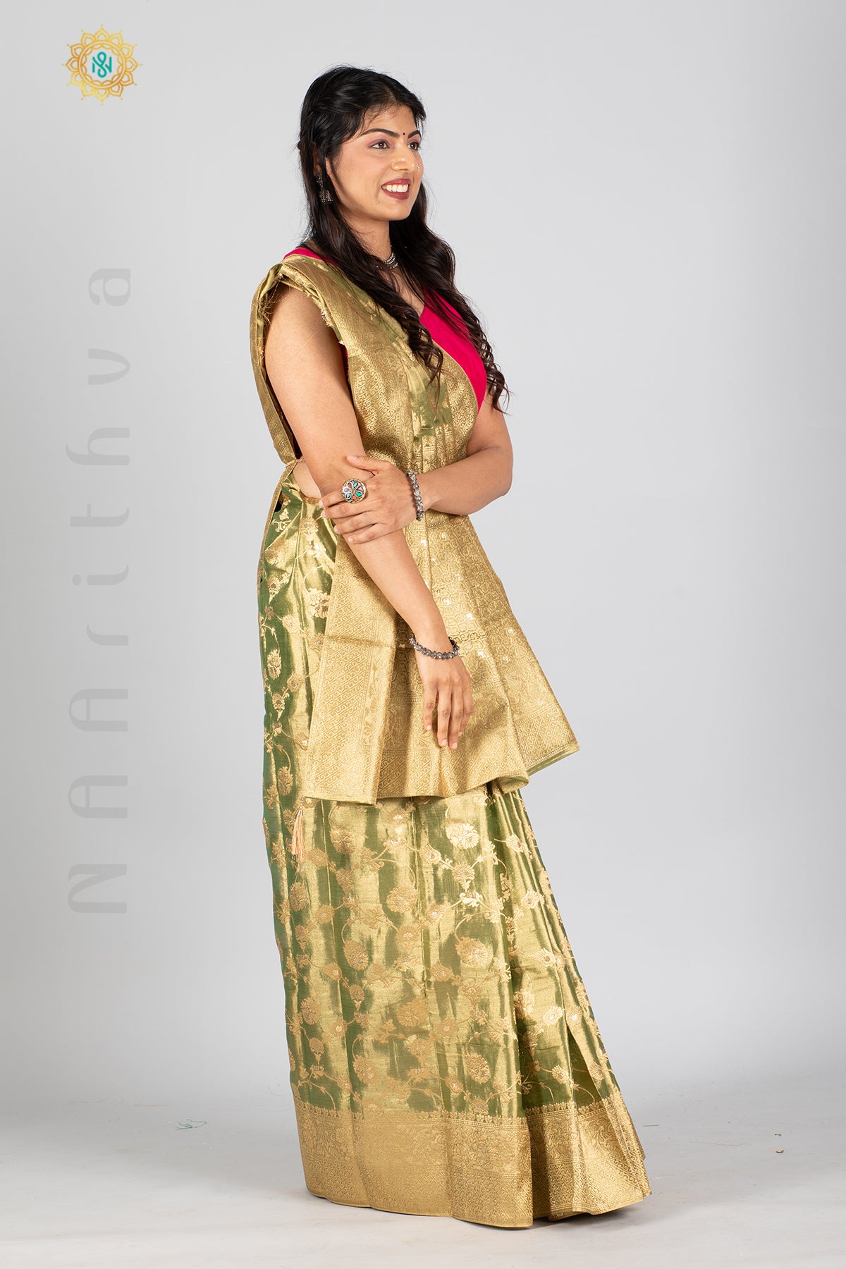 GREEN TISSUE SILK IN BROCADE WEAVES ALLOVER THE BODY WITH ZARI WOVEN PALLU & TISSUE BLOUSE