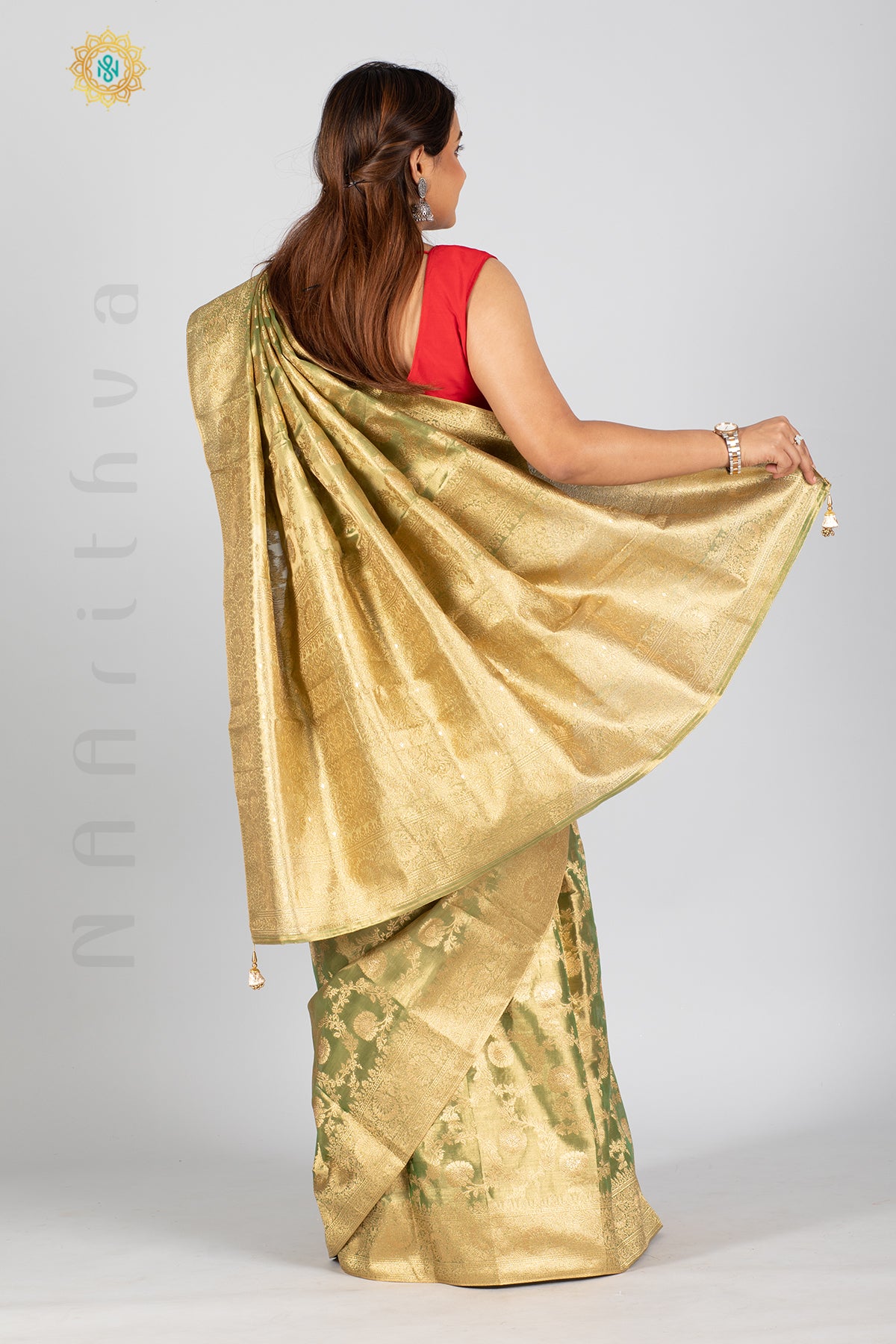 GREEN TISSUE SILK IN BROCADE WEAVES ALLOVER THE BODY WITH ZARI WOVEN PALLU & TISSUE BLOUSE