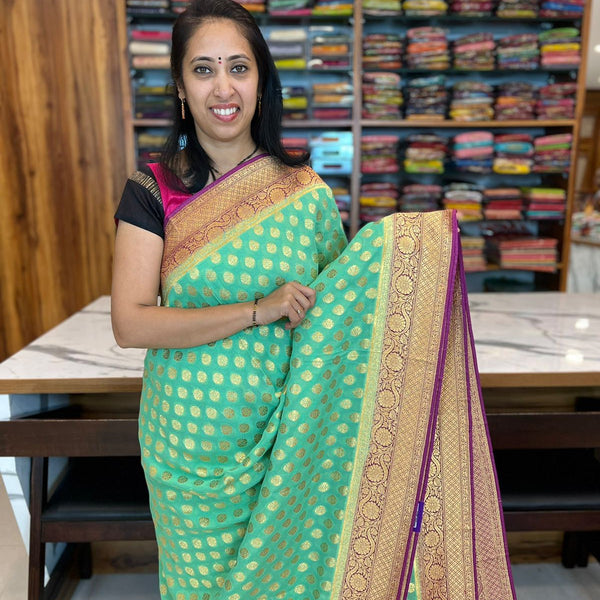 Blue Semi Jute Saree with floral vine design on its body, self-zari border  & pallu features intricate designs